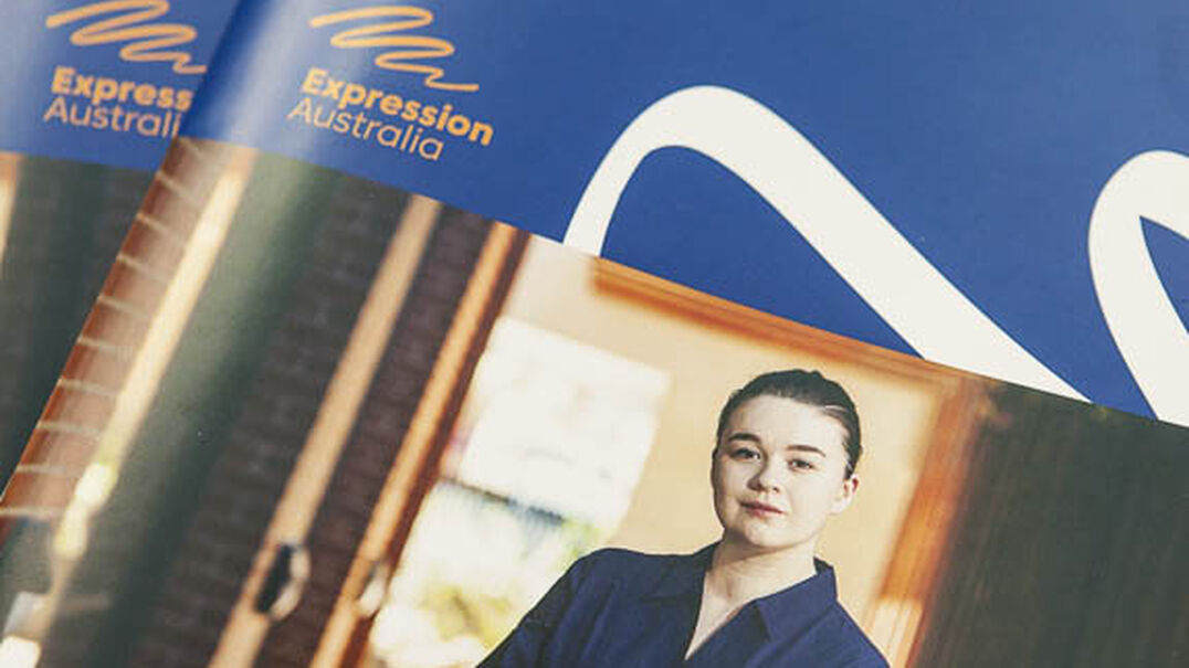 A section of the cover of Expression Australia's 2017-18 Annual Report. It shows the Expression Australia logo and a photo of a purposeful young woman.